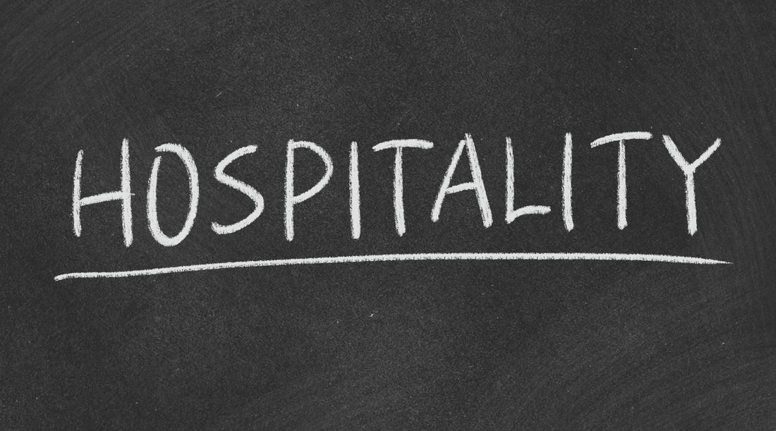 hospitality text written on black board