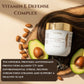 Cosmetic jar with avocado and almonds on a wooden background, promoting Vitamin E defense complex.