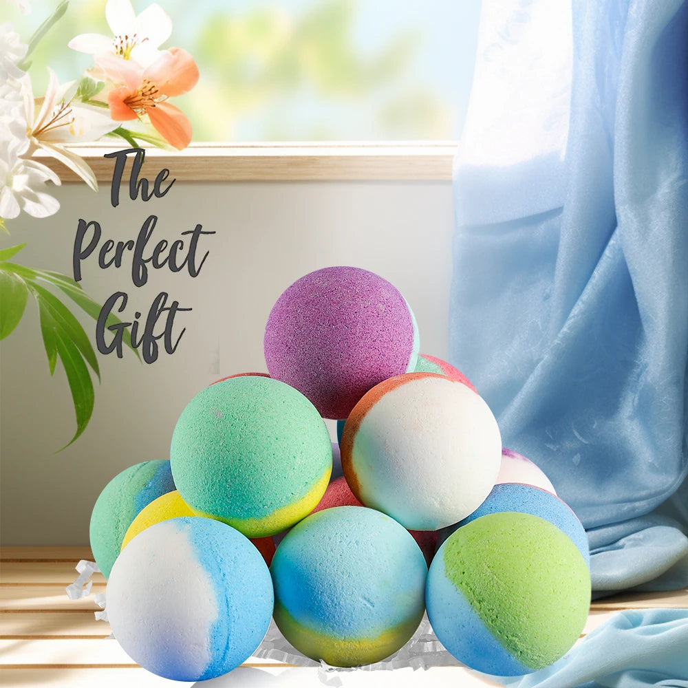 Colorful bath bombs with a 'The Perfect Gift' sign and floral decorations.