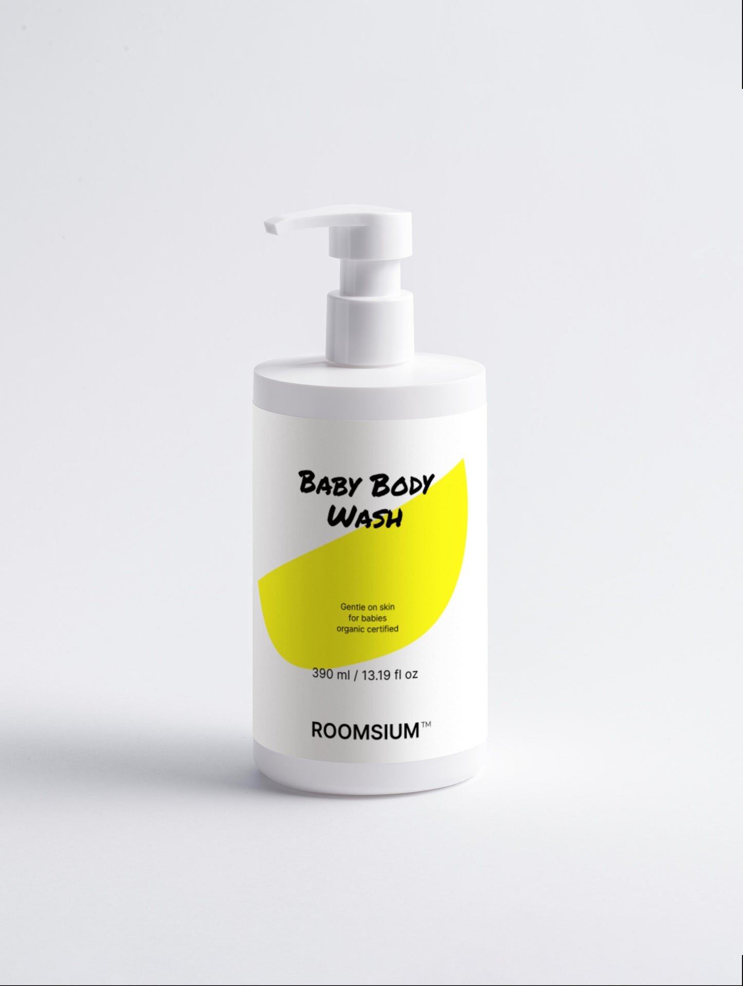 Baby body wash bottle with a yellow label on a white background