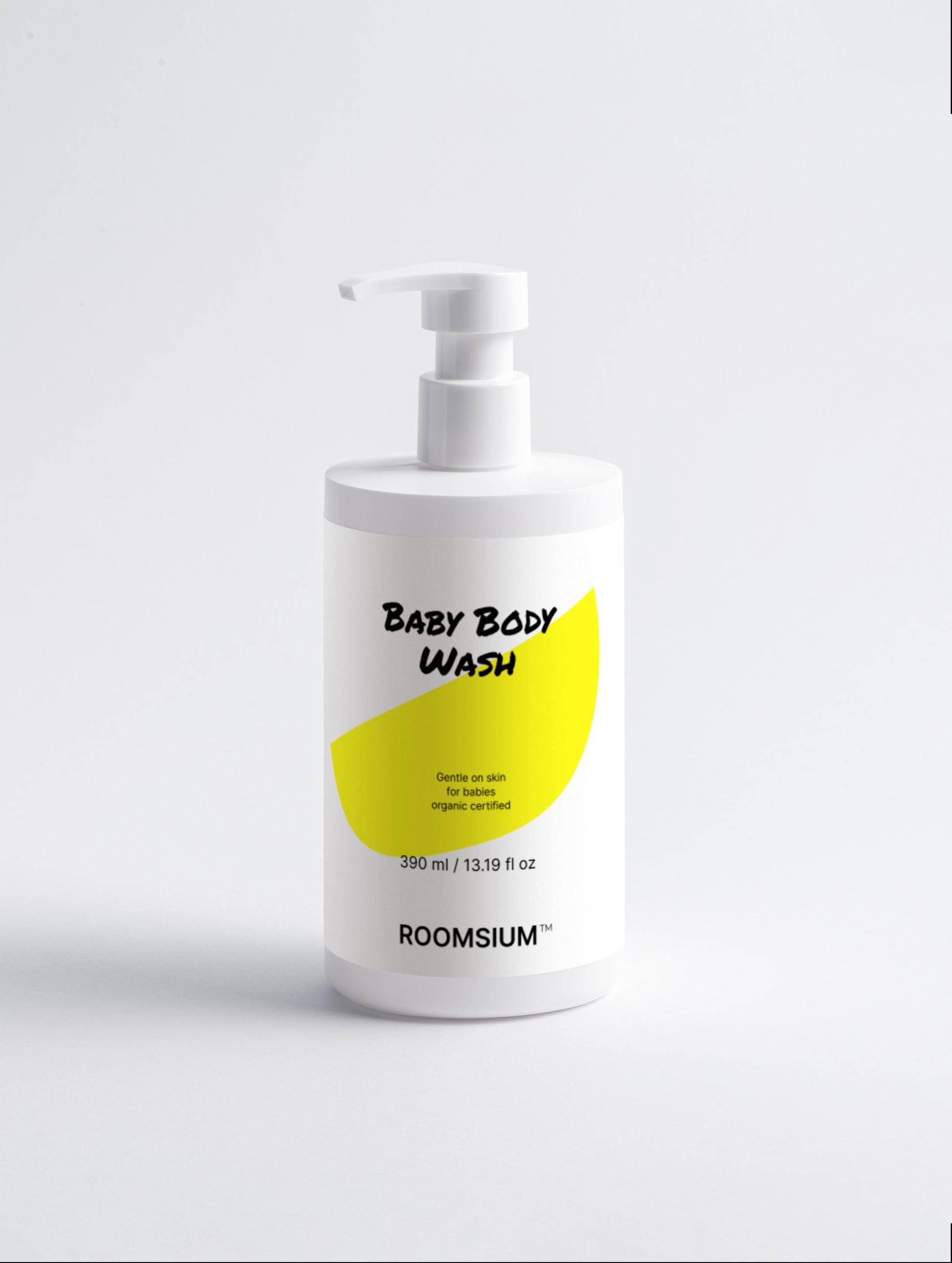 Baby body wash bottle with a yellow label on a white background